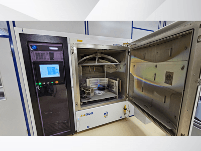 Control panel of a testing chamber by unknown brand, front view; shows touchscreen, indicators, and an open door revealing interior.
